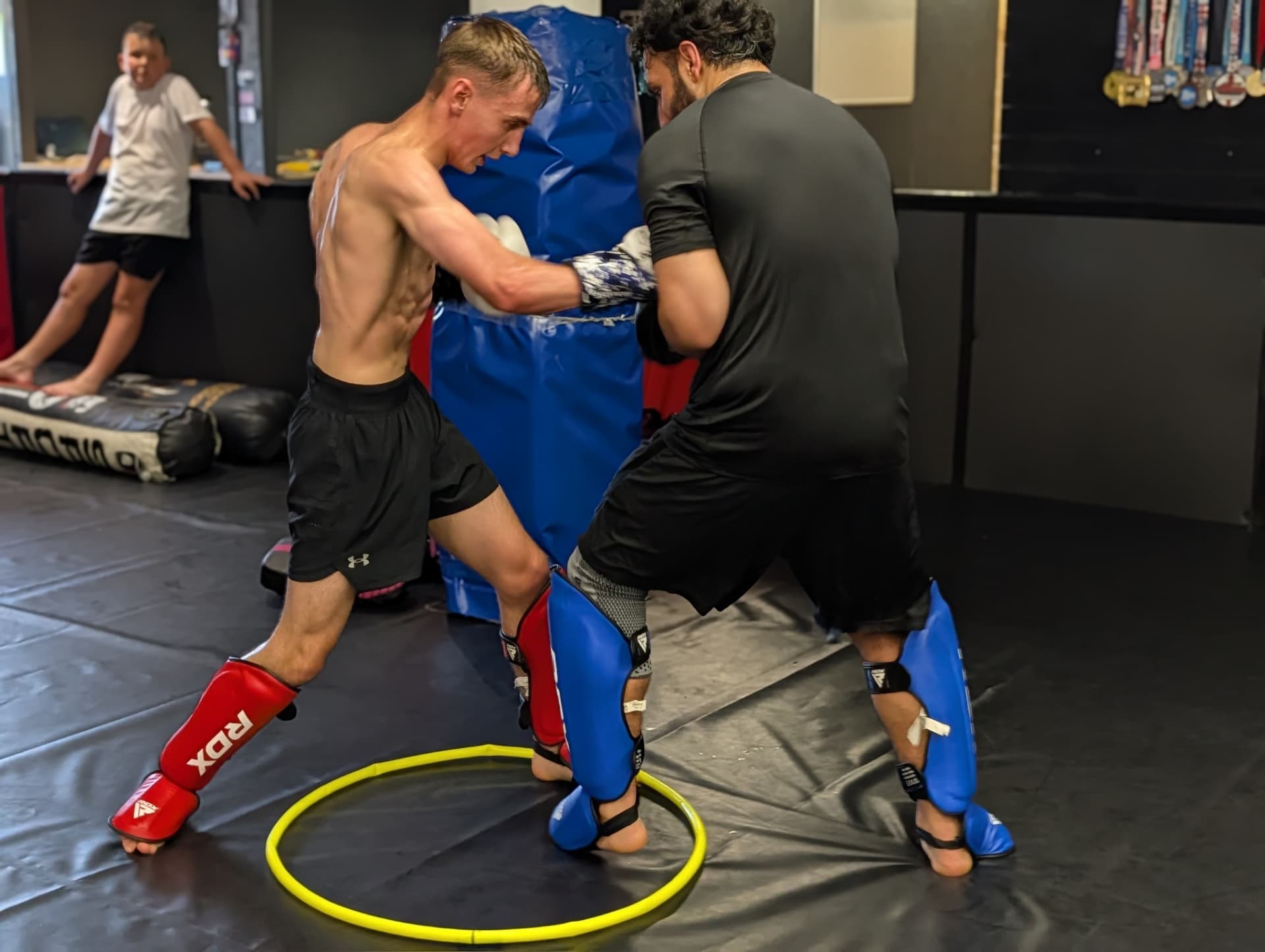 Two members sparring inside a control drill