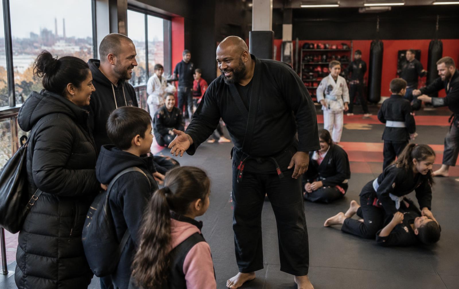 Families being welcomed into a community martial arts class